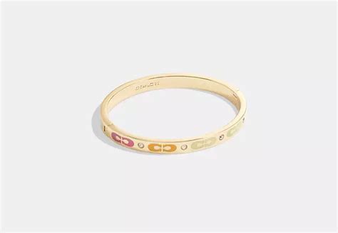 signature enamel hinged bangle.